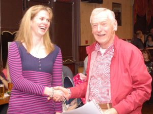 Mike Wood receives a certificate from Sally Withey