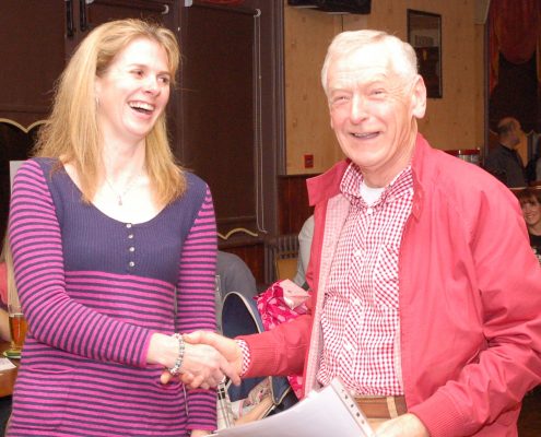 Mike Wood receives a certificate from Sally Withey