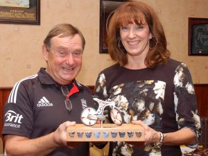 Mike Rainton with the Rider of the Year trophy and Nicki Hawkes