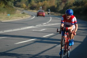 The tandem passes HQ en route to the finish