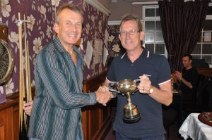 Chris Womack with one of his many trophies