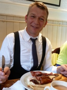 Geeorge ready to tuck in - what a snappy dresser!