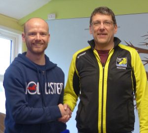 Mark Richards receives his medal from Stewart Smith